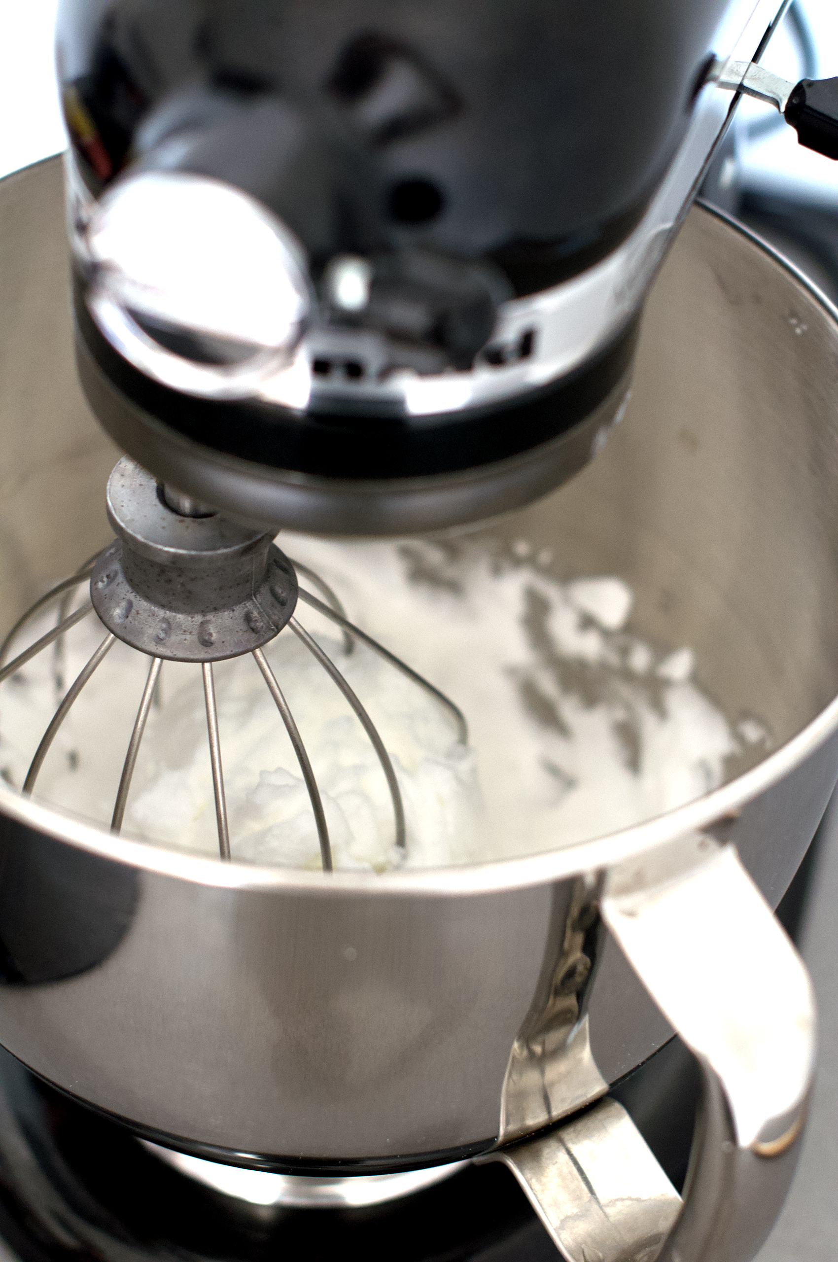 KitchenAid stand mixer whipping egg whites to stiff peaks