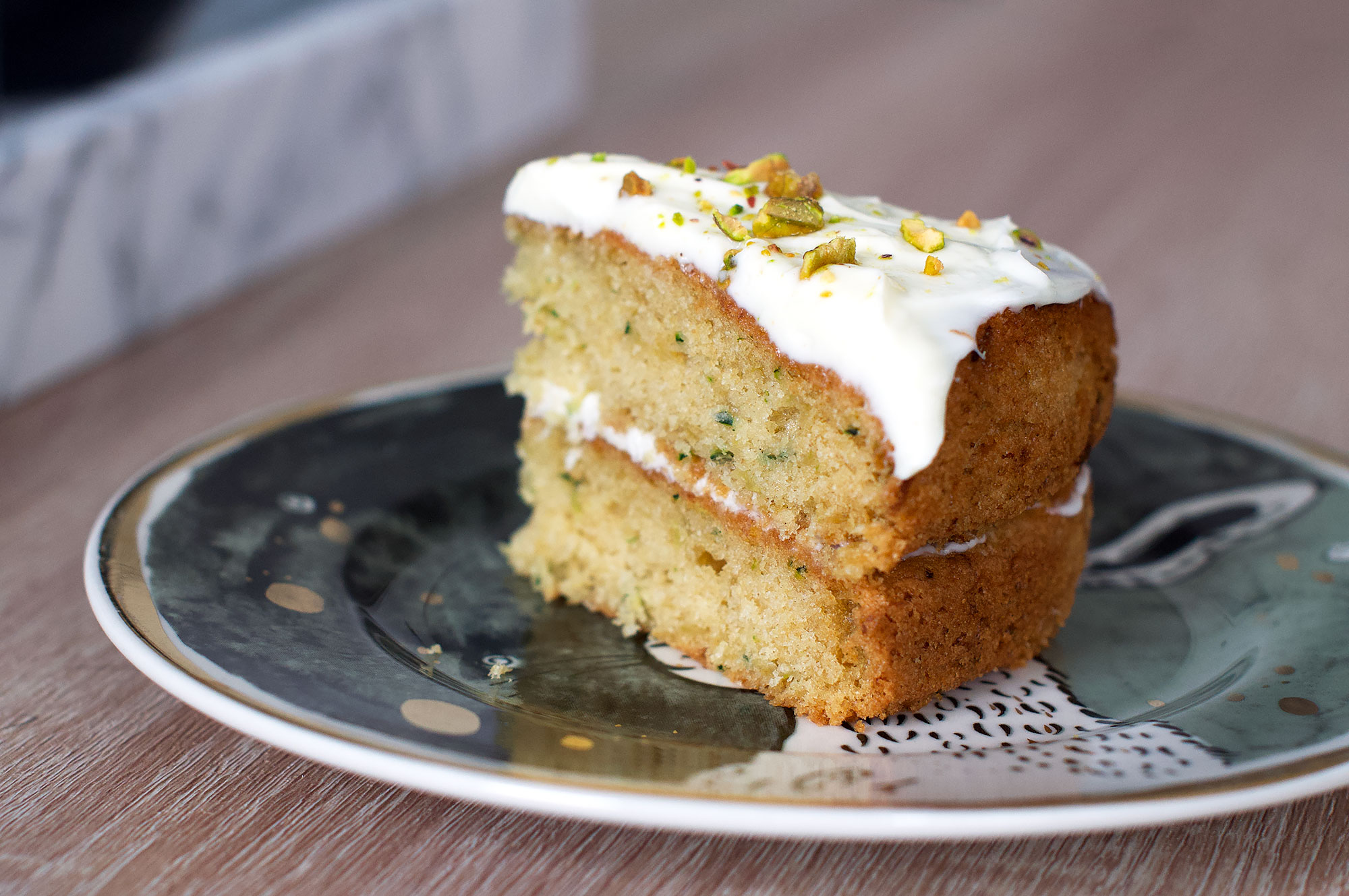 Recipe for courgette cake with cream cheese frosting and pistachios
